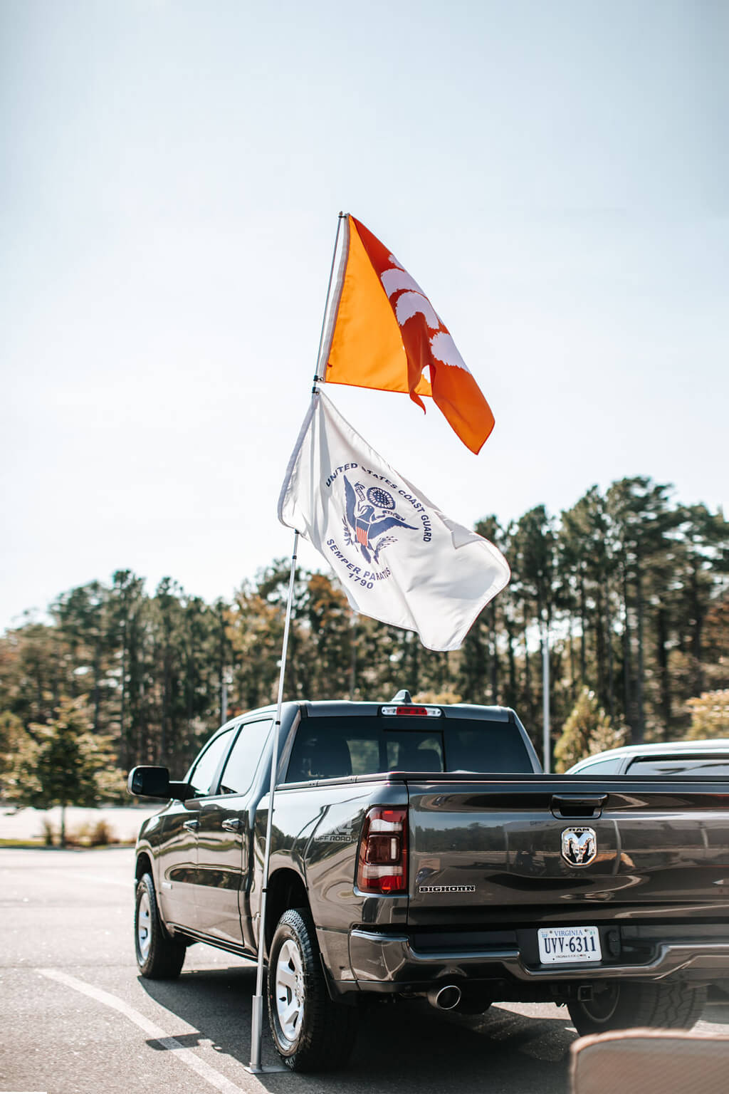 pole with coast guard flag and clemson flag