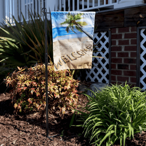 front yard flag pole with welcome flag