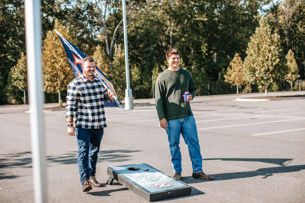 man holding short flagpole