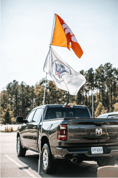 truck flying two tailgate flags