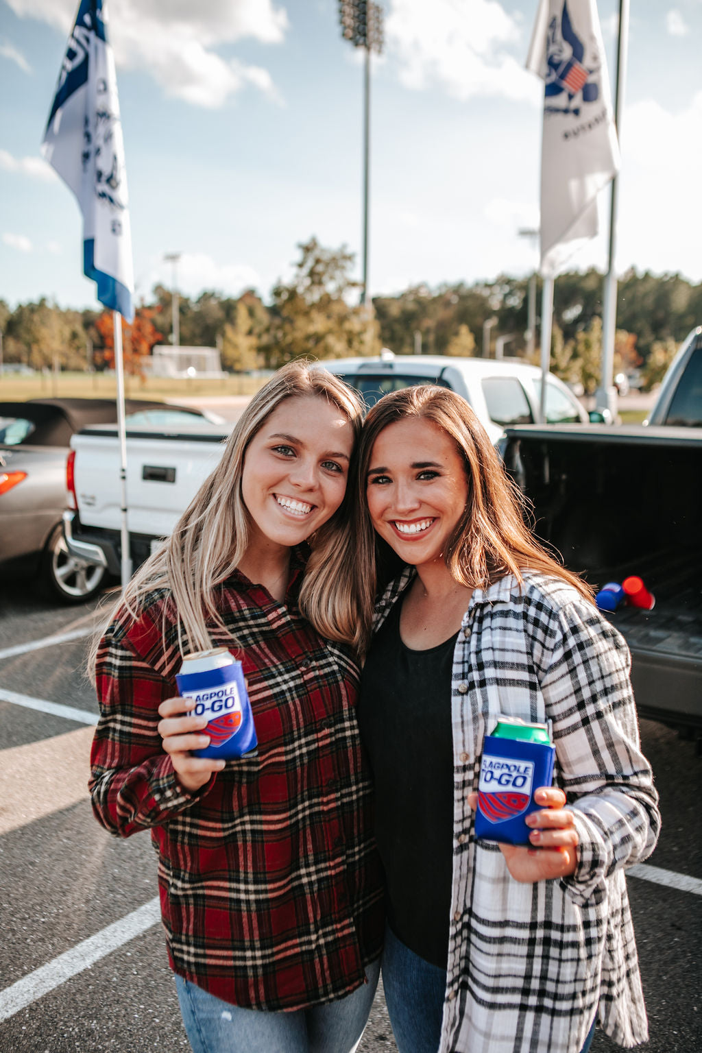 two girls smiling at tailgate